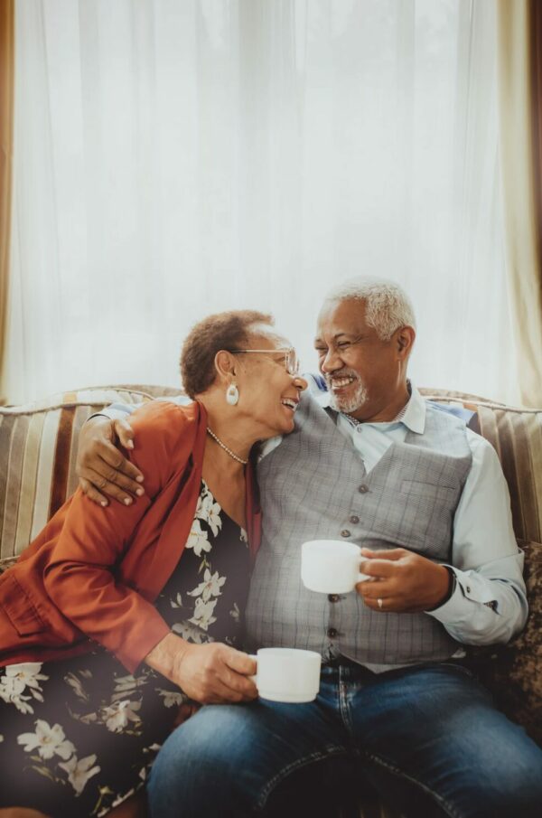 Two seniors drinking coffee together